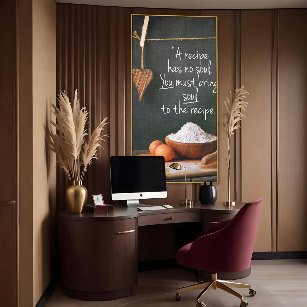 Tablou canvas cu tablou canvas cu citat culinar si faina, in rama de aluminiu auriu, pe perete intr-un birou